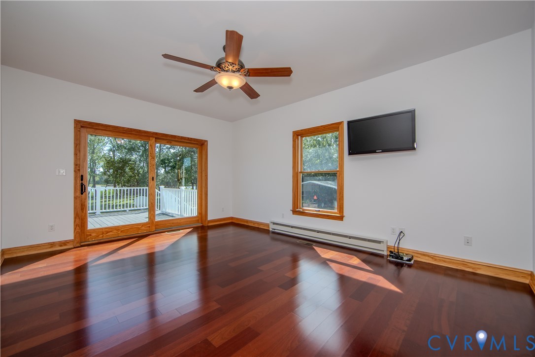19220 Mink Farm Road Onancock, VA 23417 - Photo 30 of 50 a view of room with window ceiling fan and hardwood floor