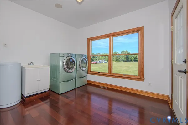 a view of a room with wooden floor and window