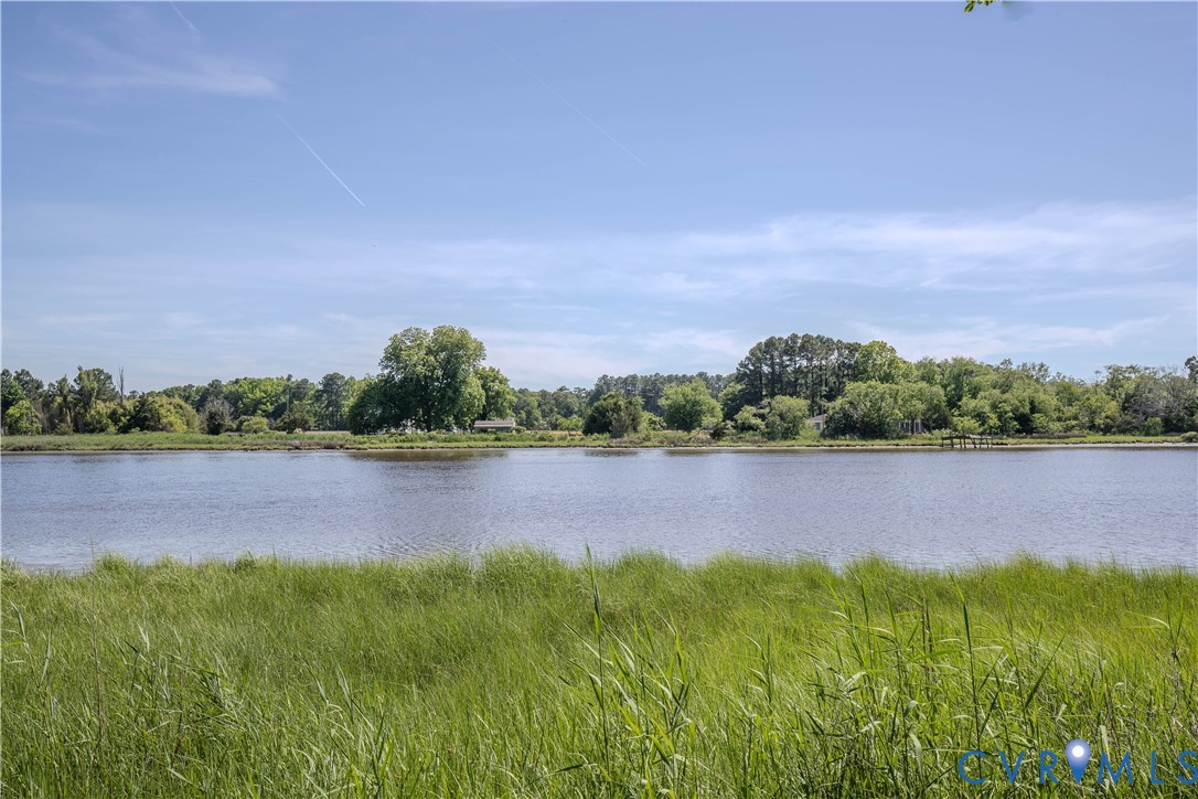 19220 Mink Farm Road Onancock, VA 23417 - Photo 39 of 50 a view of lake with green yard