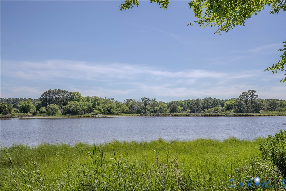19220 Mink Farm Road Onancock, VA 23417 - Photo 41 of 50 a view of a lake with houses in the back
