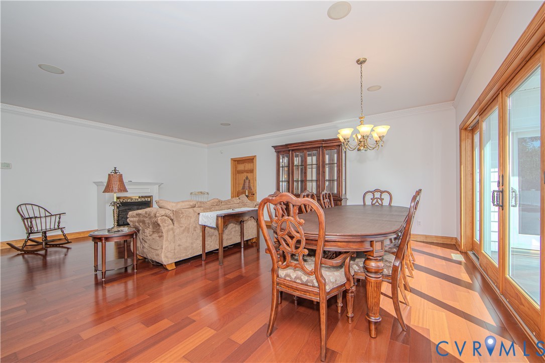 19220 Mink Farm Road Onancock, VA 23417 - Photo 8 of 50 a view of a dining room with furniture window and wooden floor