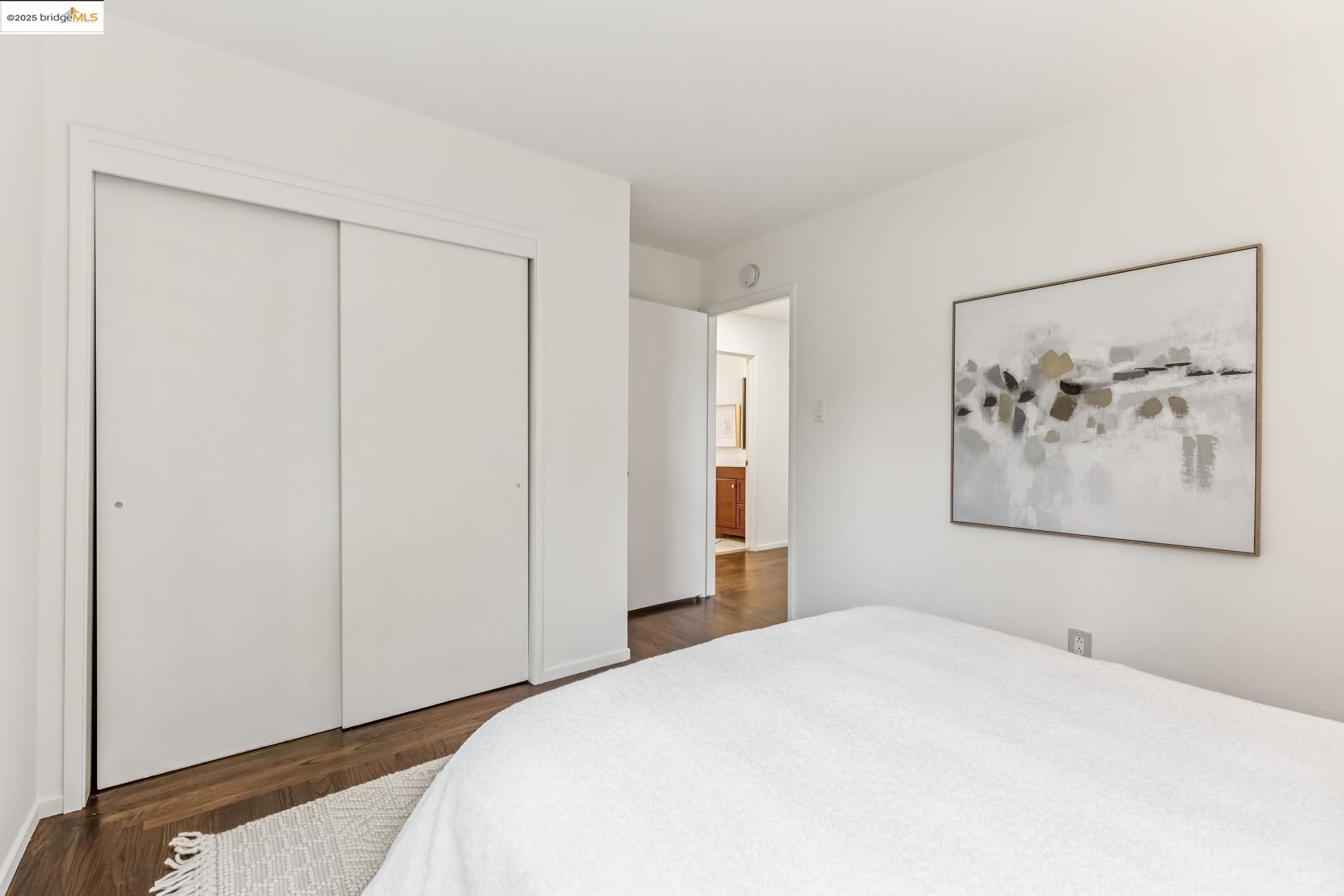 5619 Doremus Avenue Richmond, CA 94805 - Photo 15 of 45 a bedroom with a bed and painting on the wall