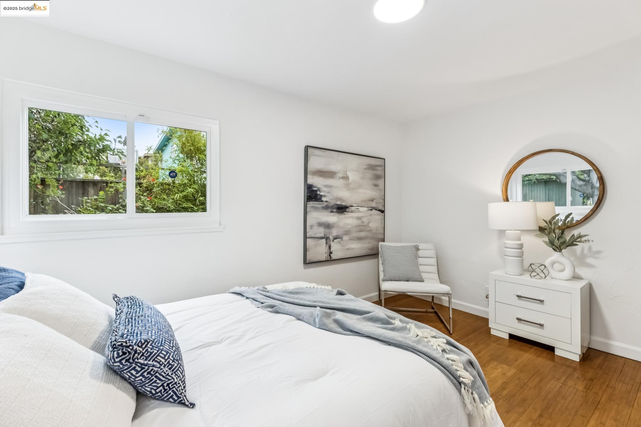 5619 Doremus Avenue Richmond, CA 94805 - Photo 26 of 45 a bedroom with a bed a couch and a window