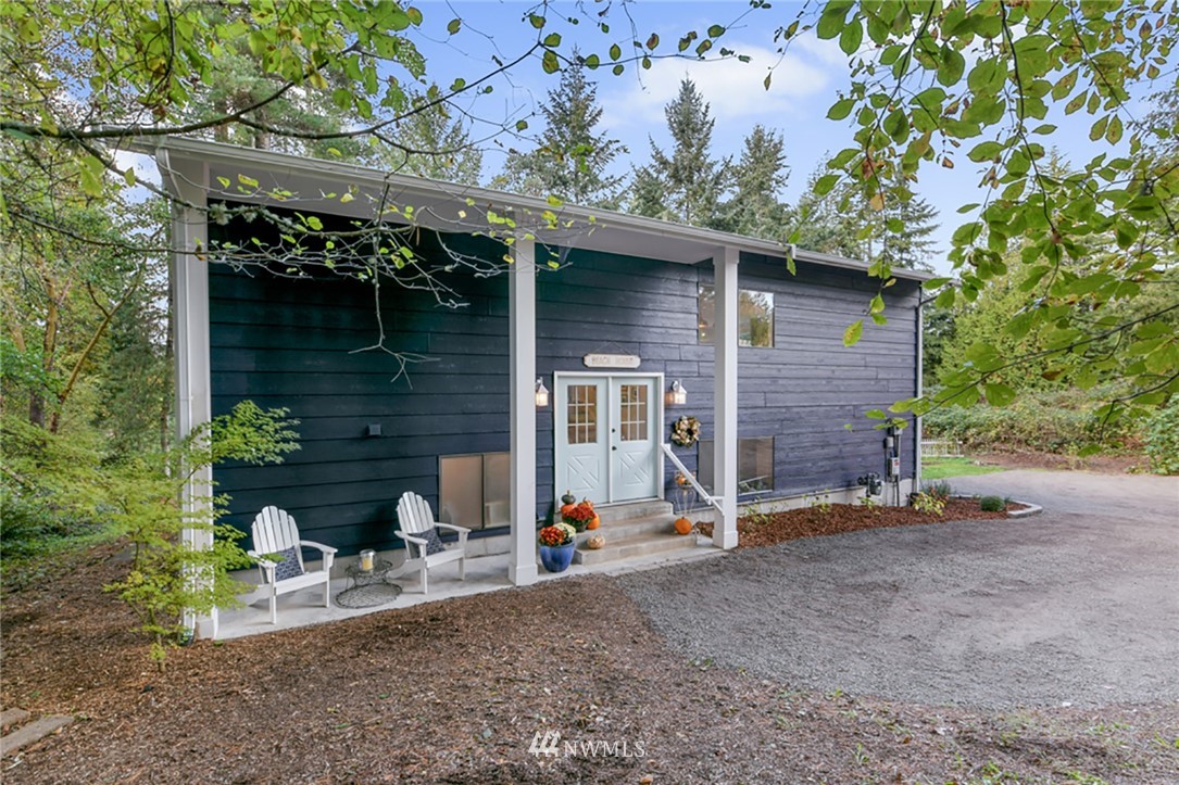 2507 Rocky Point Road Northwest Bremerton, WA 98312 - Photo 2 of 31 a view of backyard with a barn and a large tree