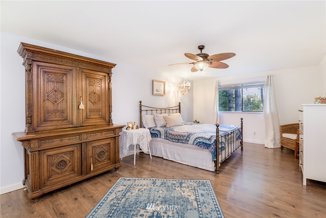 2507 Rocky Point Road Northwest Bremerton, WA 98312 - Photo 11 of 31 a living room with furniture and a fireplace