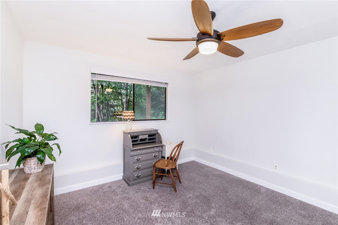 2507 Rocky Point Road Northwest Bremerton, WA 98312 - Photo 16 of 31 a living room with furniture and a potted plant