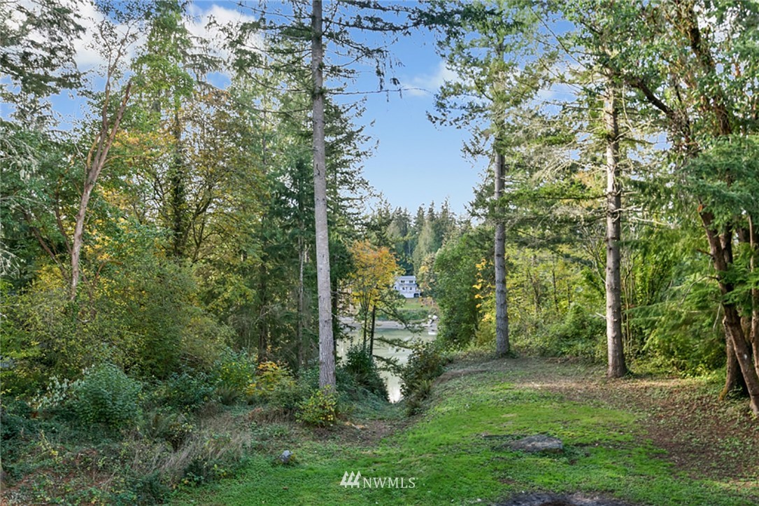 2507 Rocky Point Road Northwest Bremerton, WA 98312 - Photo 18 of 31 a view of a yard with a trees