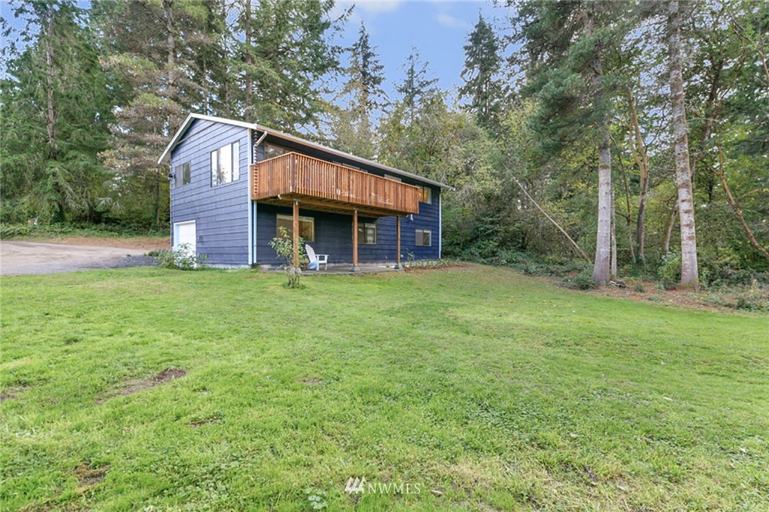 2507 Rocky Point Road Northwest Bremerton, WA 98312 - Photo 22 of 31 a view of a house with a yard