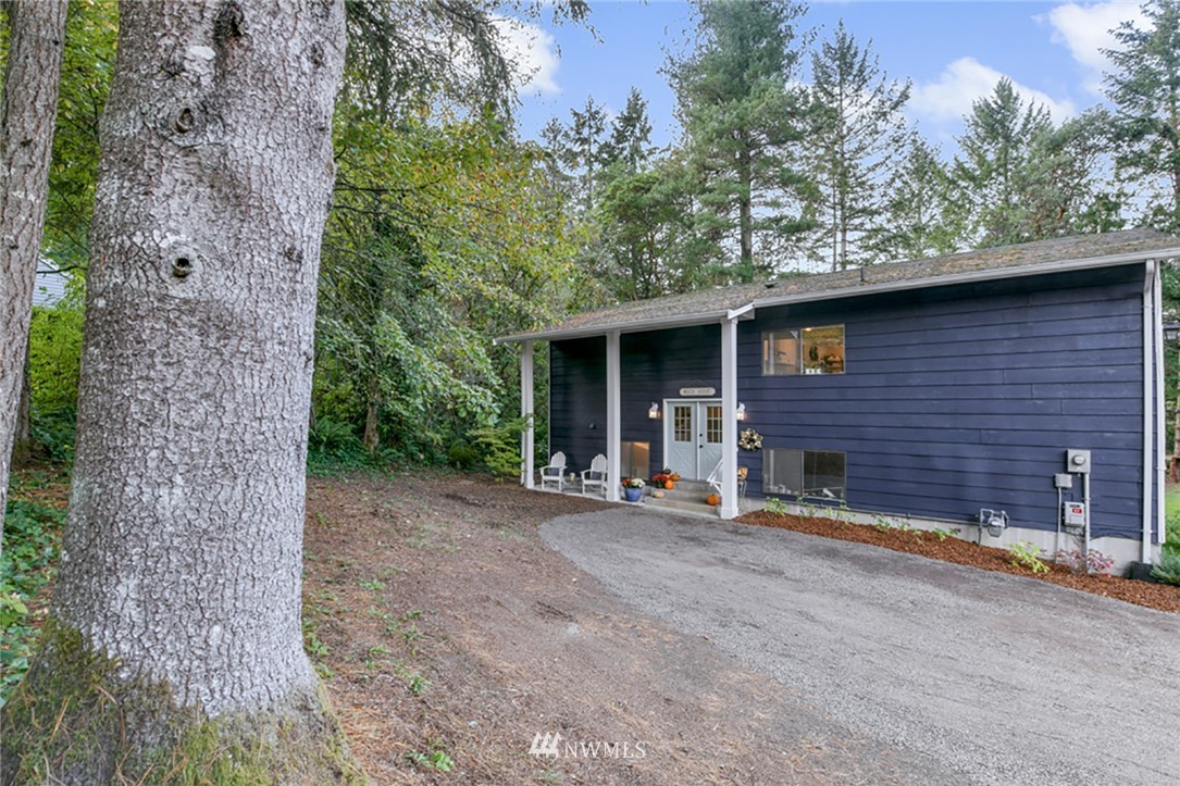 2507 Rocky Point Road Northwest Bremerton, WA 98312 - Photo 30 of 31 a view of a brick house with a large tree