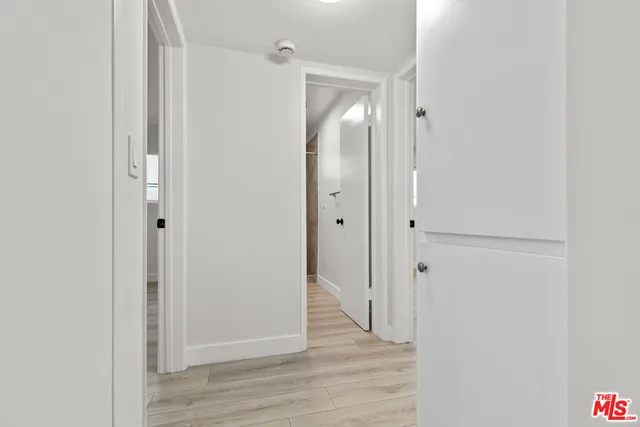 a bathroom with a shower sink mirror and toilet