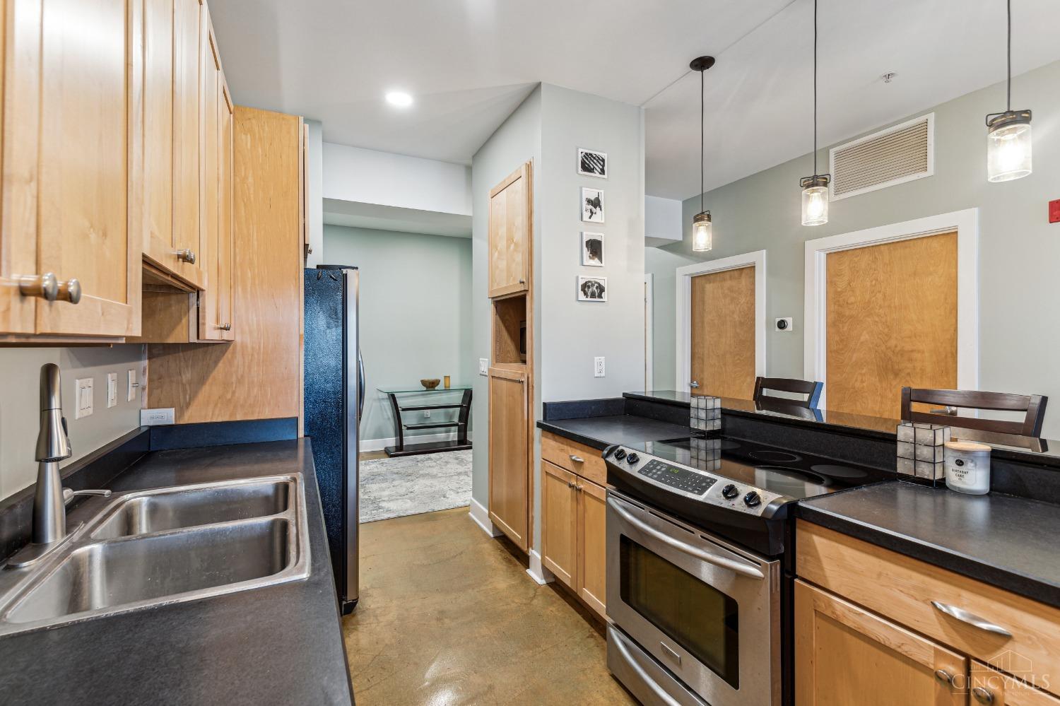 2260 Riverside Drive, Unit 205 Cincinnati, OH 45202 - Photo 10 of 37 The well equipped kitchen features maple, shaker style, wood Merrillat Cabinetry, an island for entertaining, complimentary modern pendant lighting and a Frigidaire stainless appliance package...