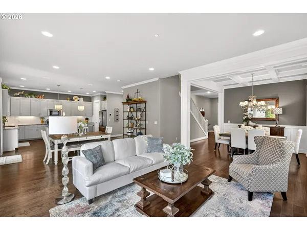a living room with furniture kitchen view and a dining table