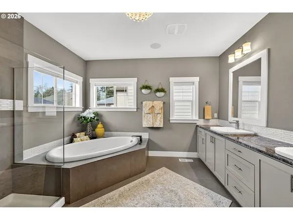 a living room with stainless steel appliances kitchen island granite countertop furniture and a large window
