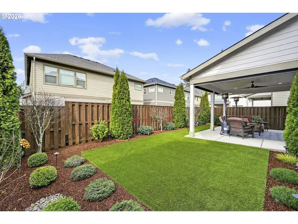 a view of a porch with chairs and backyard