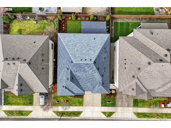 an aerial view of a house with a garden and plants