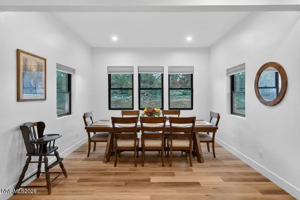 a view of a dining room with furniture window and outside view