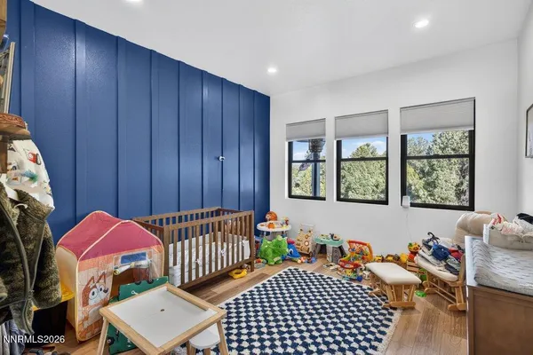 a bedroom with furniture and a window