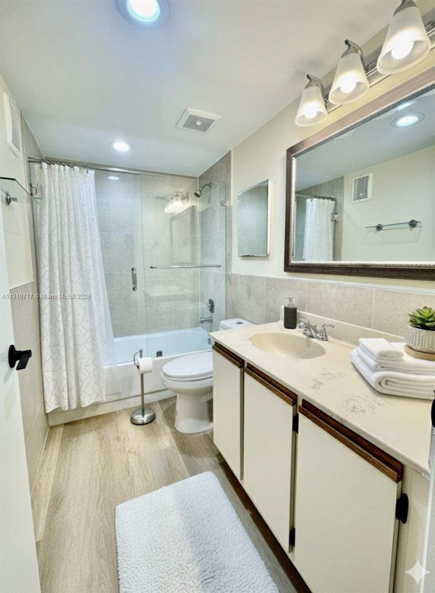 10985 Southwest 107th Street, Unit 216 Miami, FL 33176 - Photo 17 of 39 a bathroom with a granite countertop sink and a mirror