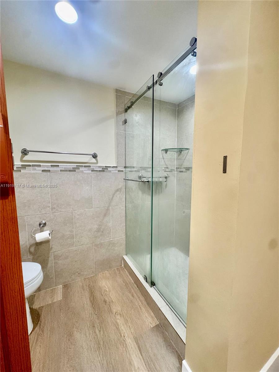 10985 Southwest 107th Street, Unit 216 Miami, FL 33176 - Photo 29 of 39 a bathroom with a shower and toilet