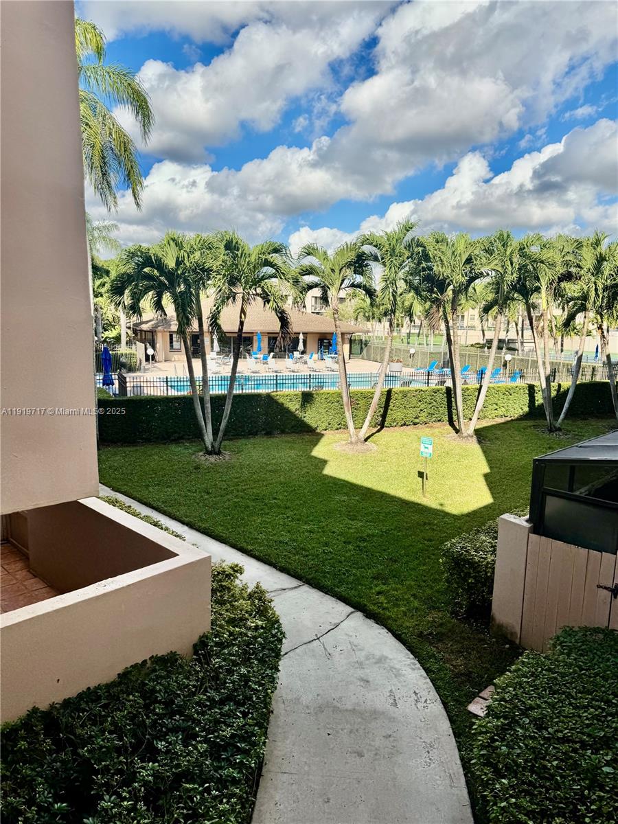 10985 Southwest 107th Street, Unit 216 Miami, FL 33176 - Photo 32 of 39 a view of a garden with houses