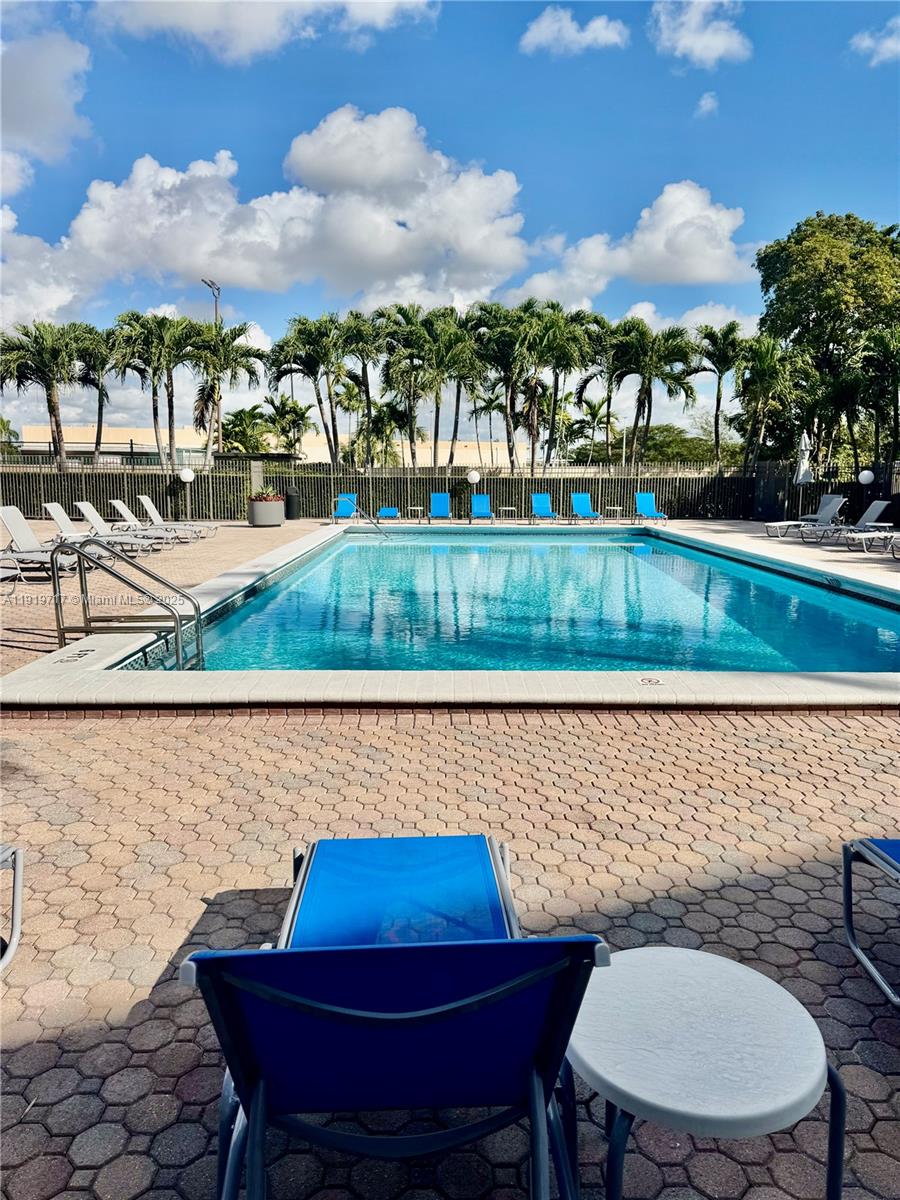 10985 Southwest 107th Street, Unit 216 Miami, FL 33176 - Photo 35 of 39 a view of a chairs and table in patio