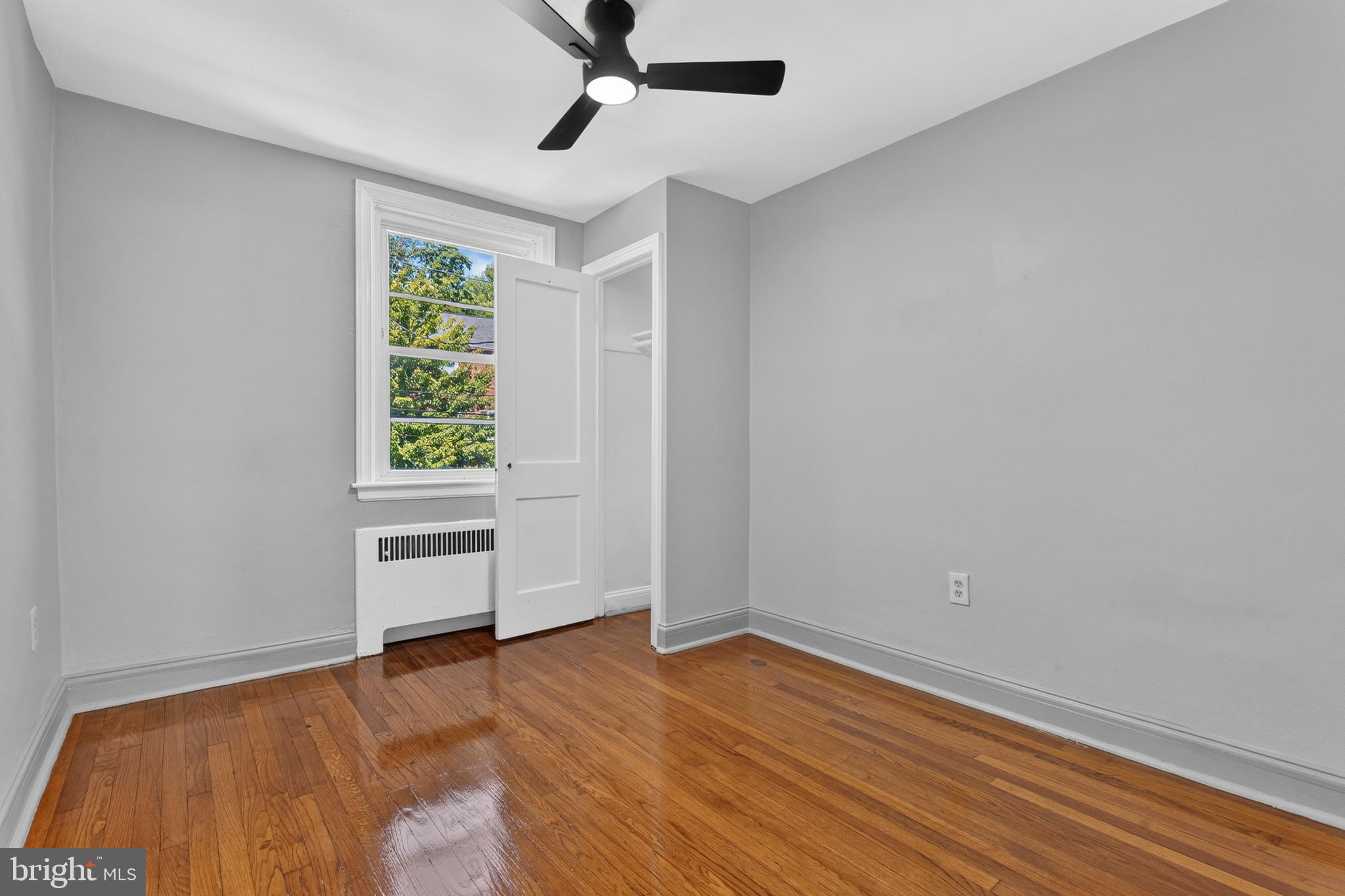 3906 Yolando Road Baltimore, MD 21218 - Photo 16 of 30 wooden floor in an empty room with a window