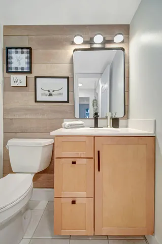 a bathroom with a double vanity sink and mirror
