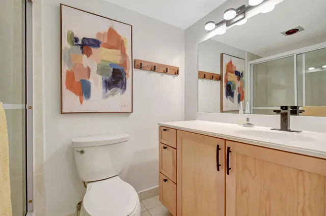 a bathroom with a glass shower door