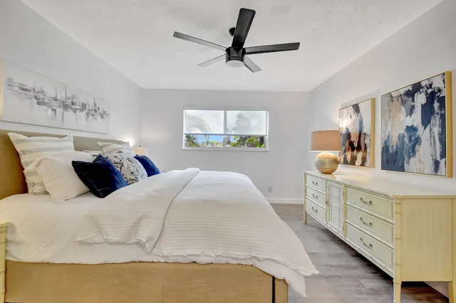 a bathroom with a sink a mirror and lamp