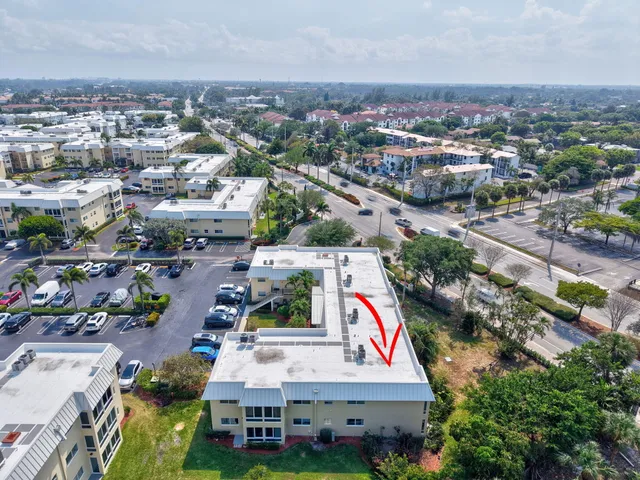 a front view of building with yard