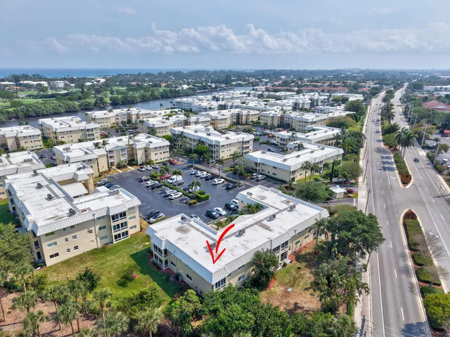 a dining room with furniture and a book shelf