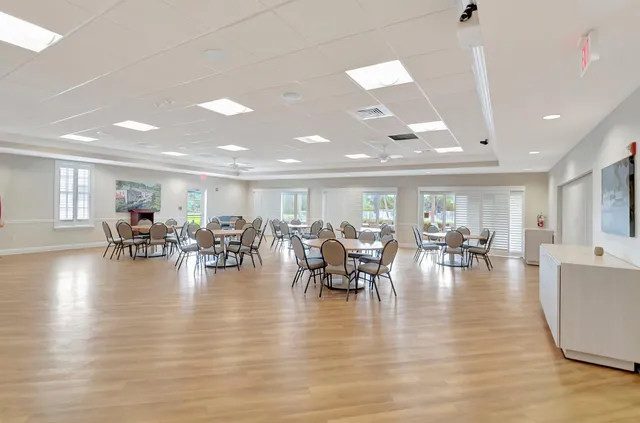 a view of a backyard with plants and a lake view