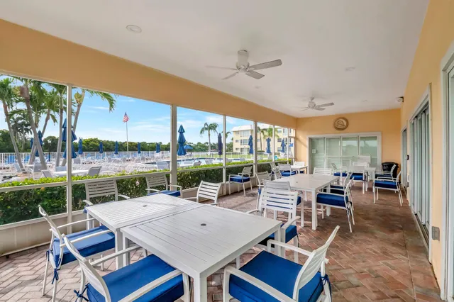 a swimming pool with outdoor seating and yard