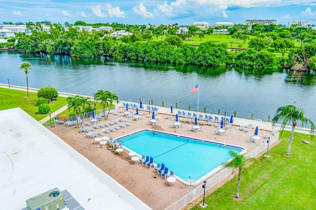 a room with pool table and wooden floor