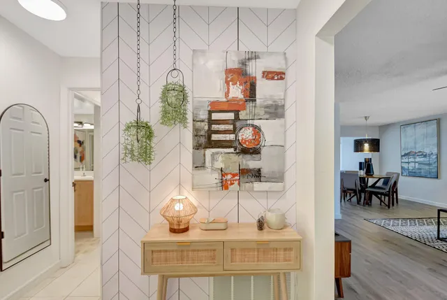 a living room with furniture and a painting