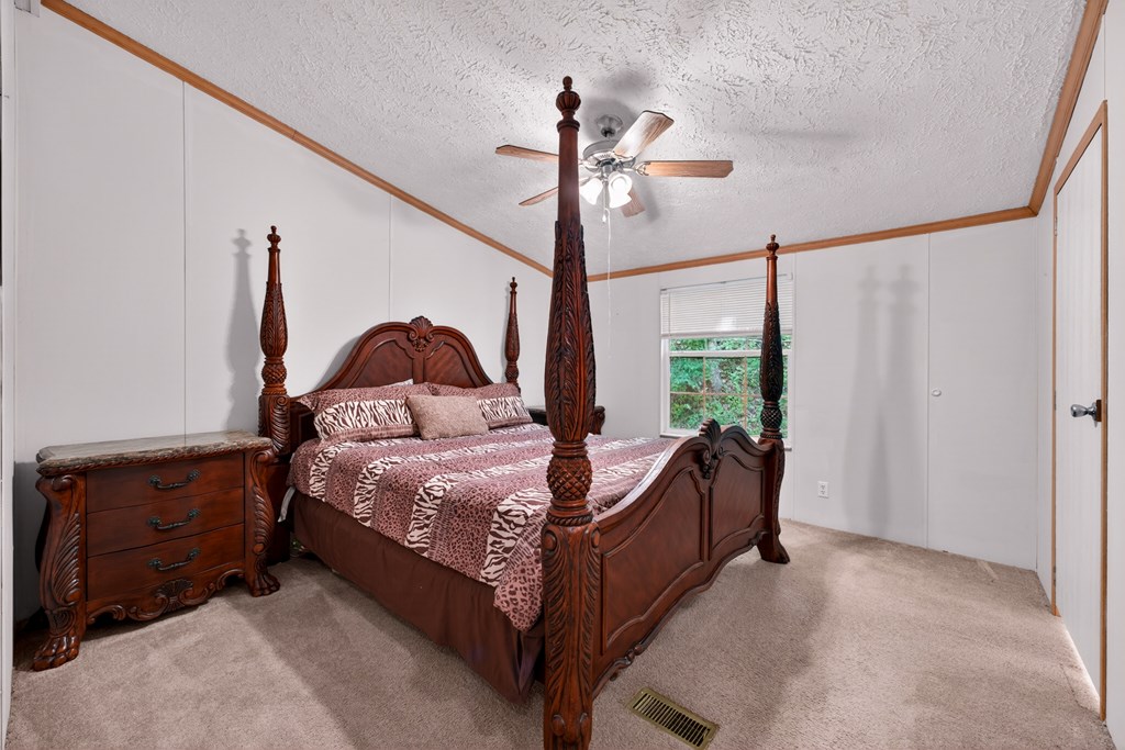 282 West Cherry Road Hayesville, NC 28904 - Photo 12 of 45 a bed room with a bed and a window