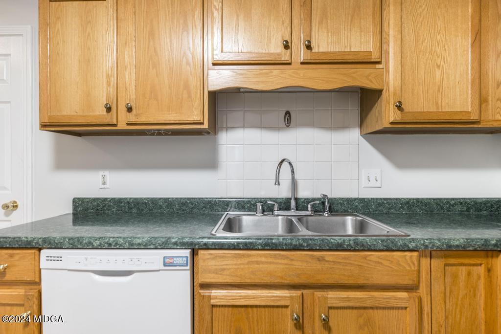 114 Wesleyan Way Macon, GA 31210 - Photo 13 of 28 a kitchen with granite countertop white cabinets and a sink