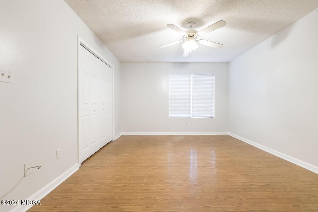 114 Wesleyan Way Macon, GA 31210 - Photo 15 of 28 wooden floor in an empty room with a window
