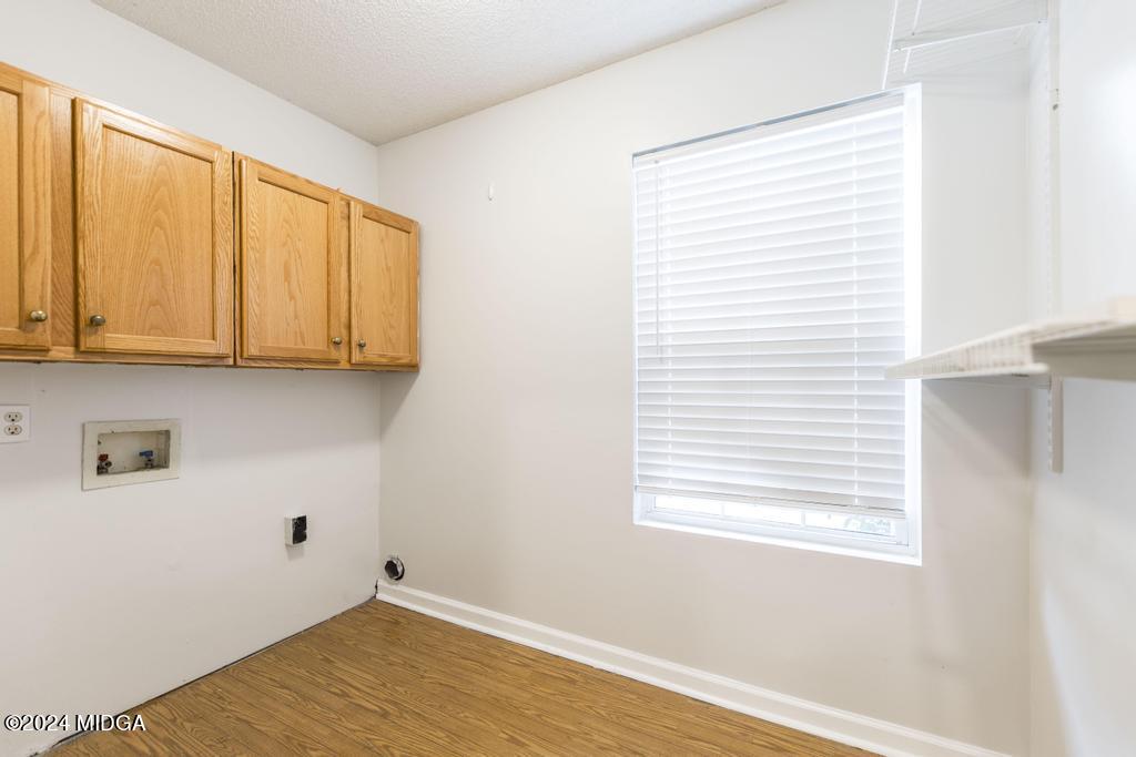 114 Wesleyan Way Macon, GA 31210 - Photo 24 of 28 a view of a kitchen with wooden floor and a window