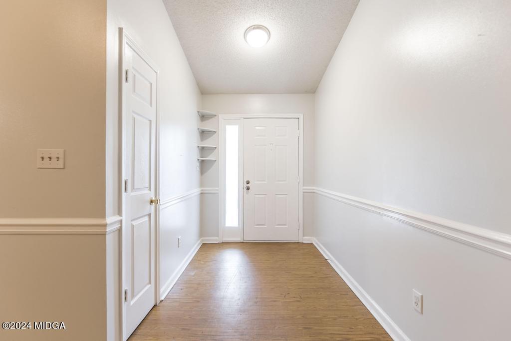 114 Wesleyan Way Macon, GA 31210 - Photo 5 of 28 a view of a hallway with wooden floor and staircase