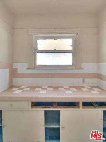 a close view of sink and cabinets