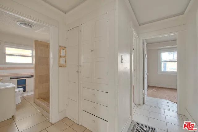 a bathroom with a shower and a sink