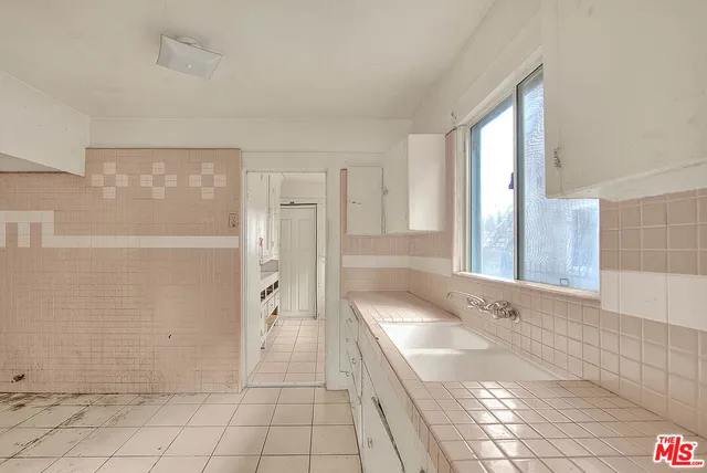 a bathroom with a bathtub and shower