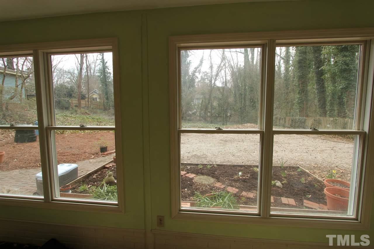 2823 Oberry Street Raleigh, NC 27607 - Photo 20 of 25 View from utility room. Looks out on yard and parking area