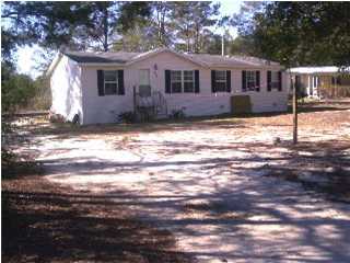 597 Roberts Road East DeFuniak Springs, FL 32433 - Photo 1 of 1 a front view of a house with a yard