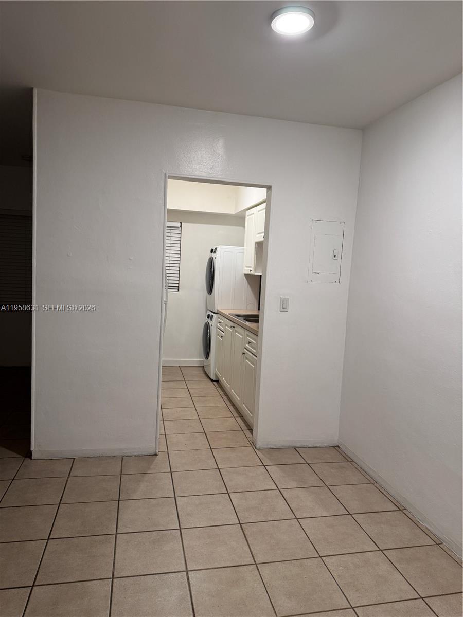 921 Meridian Avenue, Unit 7 Miami Beach, FL 33139 - Photo 16 of 33 a view of a livingroom with wooden cabinets