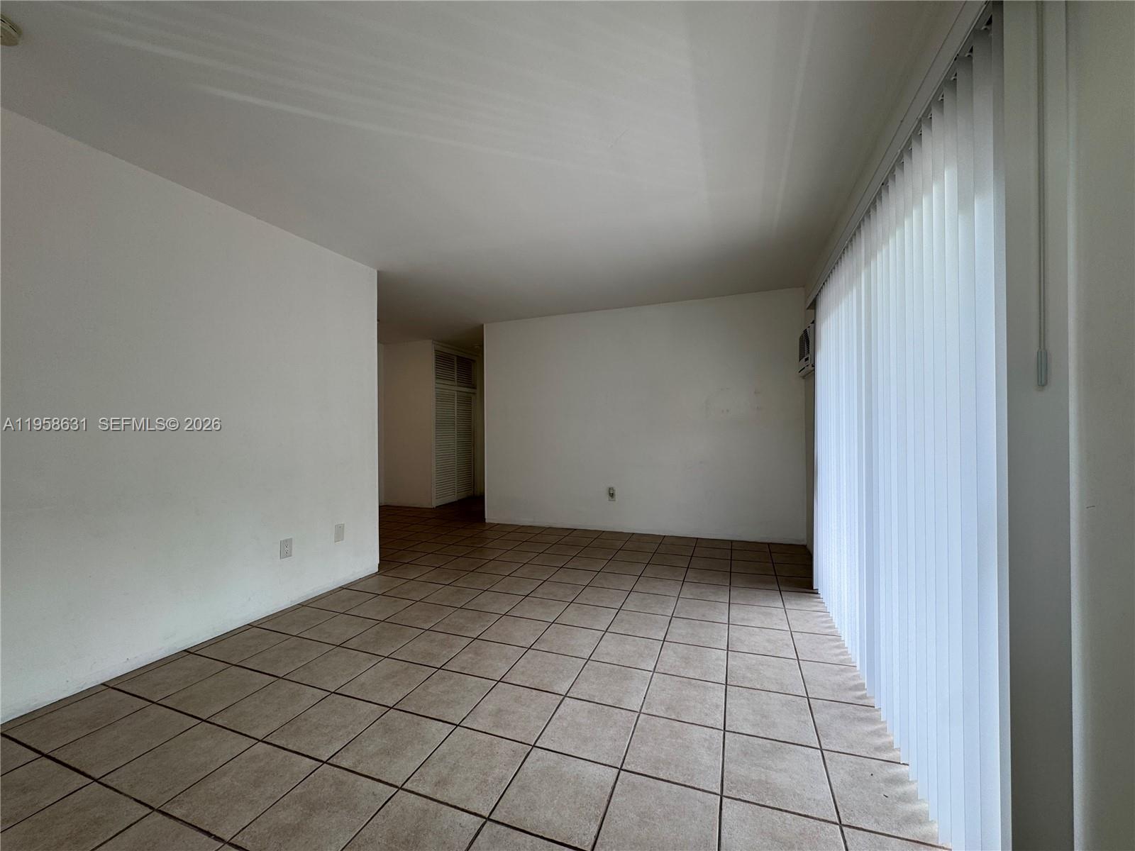 921 Meridian Avenue, Unit 7 Miami Beach, FL 33139 - Photo 3 of 33 a view of an empty room and window