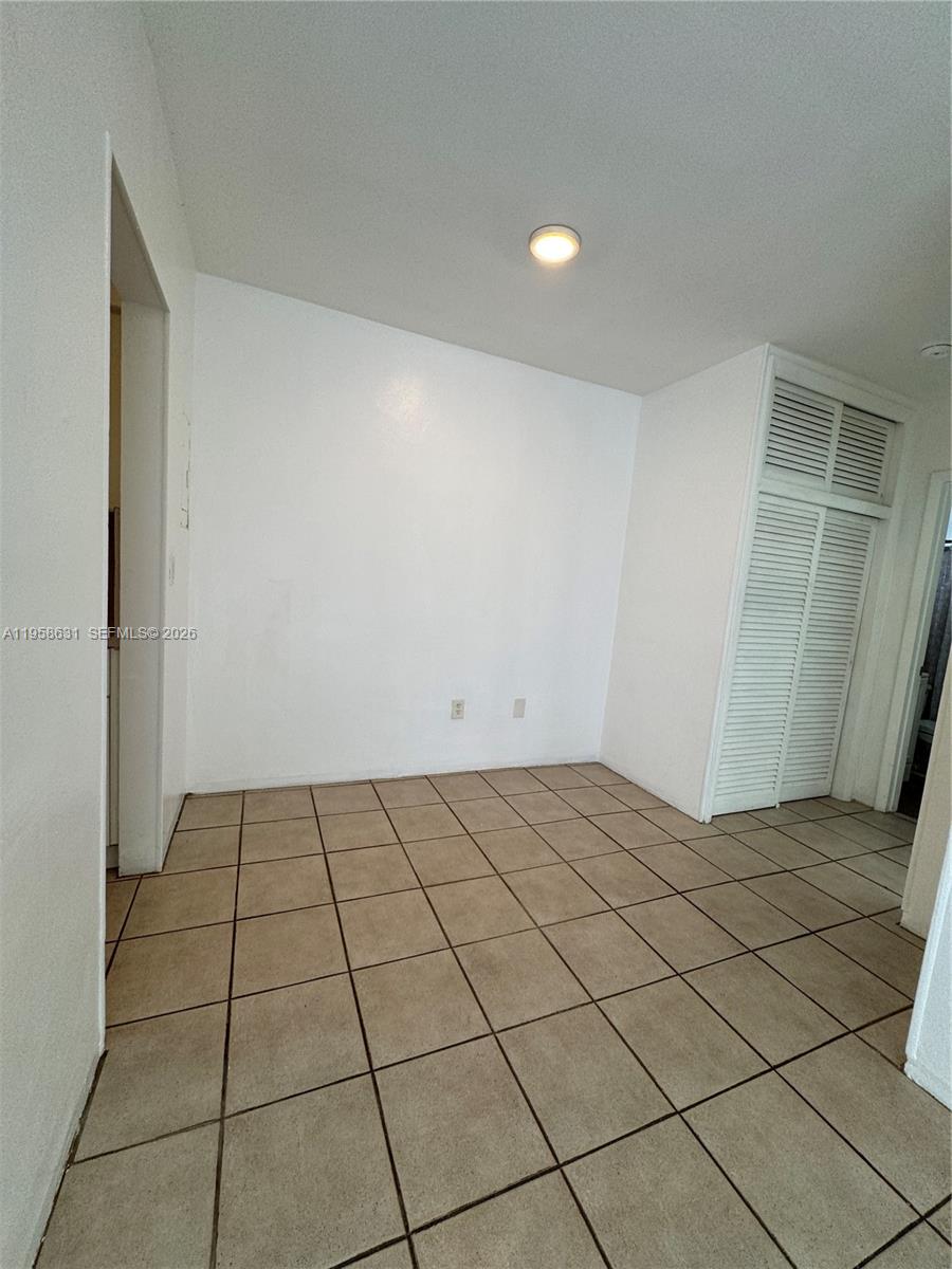 921 Meridian Avenue, Unit 7 Miami Beach, FL 33139 - Photo 31 of 33 a view of an empty room and window