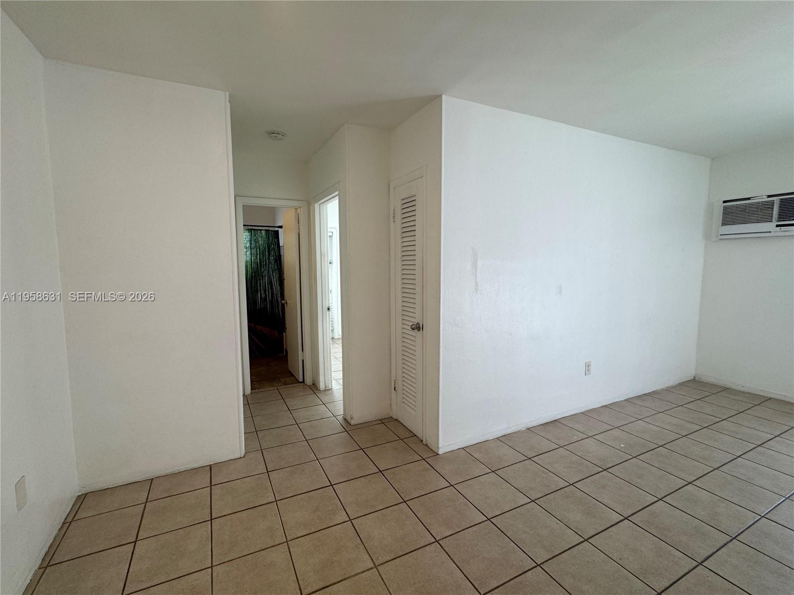 921 Meridian Avenue, Unit 7 Miami Beach, FL 33139 - Photo 5 of 33 a view of an empty room and window