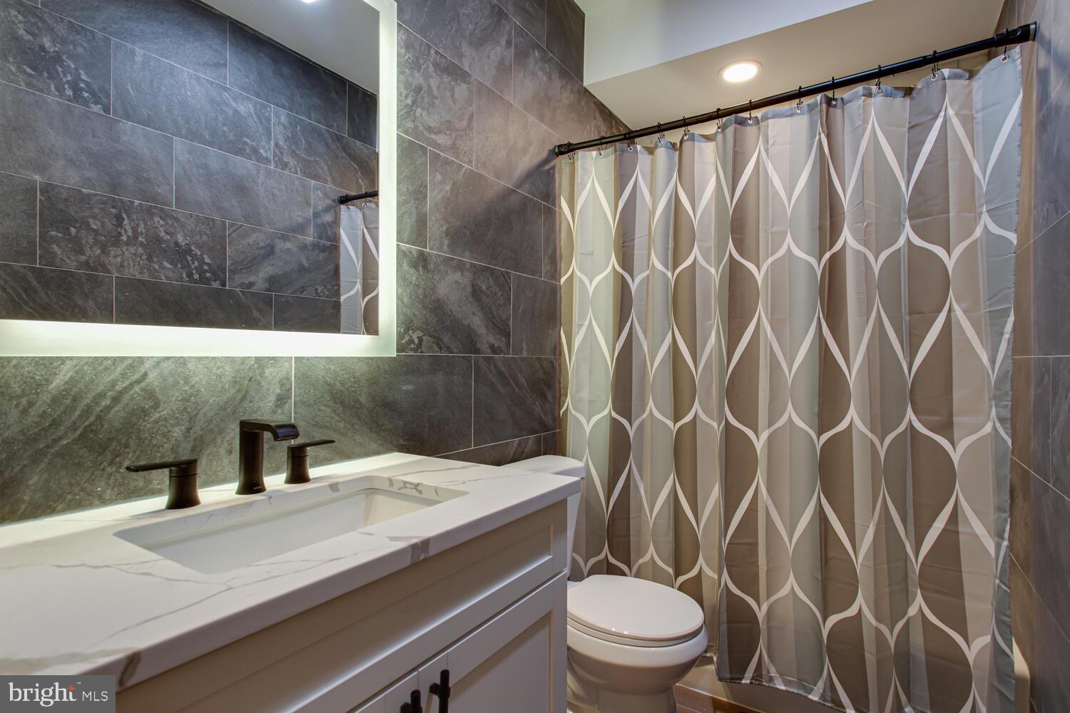 3554 13th Street Northwest, Unit 1 Washington, DC 20010 - Photo 17 of 25 a bathroom with a sink and a toilet